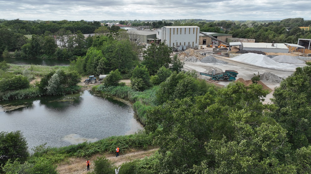 Aerial view of Lignacite factory with water way to the side