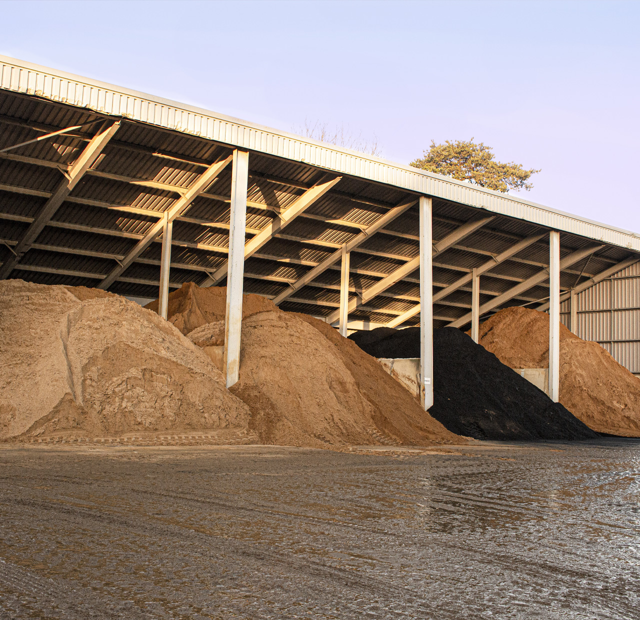 Raw materials for concrete blocks in a store at Lignacite